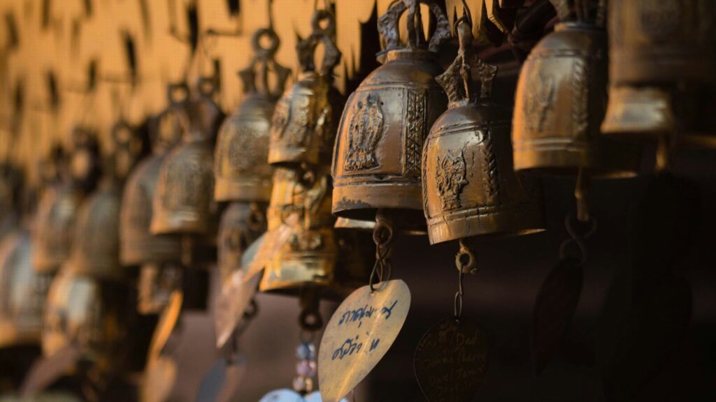 Buddhist temple bells in golden and bronze colours.